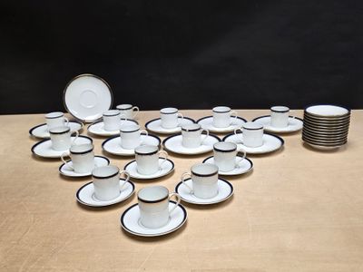 a lot of cups and saucers on the table