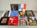 various album covers of various music albums on a table