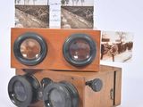 a wooden box with two cameras on top of it