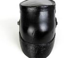a black hat that is sitting on a white surface