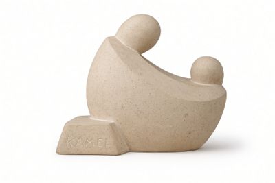a small stone sculpture of a man and a child