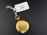 a close up of a gold locke with a tag on it