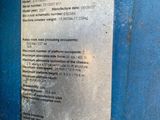 an image of a blue machine with a label on it