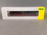 a close up of a toy train in a box on a table