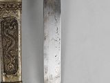 pair of antique silver plated knifes with ornate decoration on them