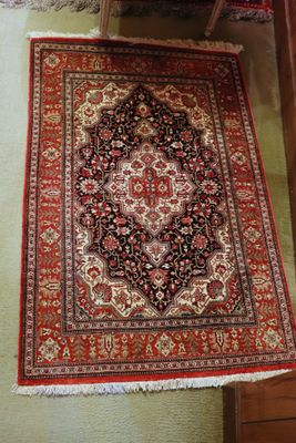 an oriental rug on the floor in a living room