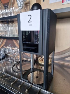bottles and glasses are lined up on the bar at a restaurant