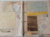 an open book with a lot of papers on it