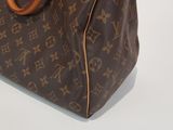 an image of a louis vuitton handbag on a white surface