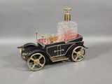 a small toy car with a bottle of liquor in it