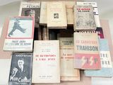 a lot of old books on a table together