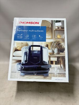 gros plan d'une boîte d'aspirateur sur une table