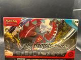 a close up of a box of pokemon trading cards on a table