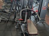 a gym with a lot of machines in the room