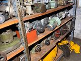 many different types of tools on the shelves in the garage
