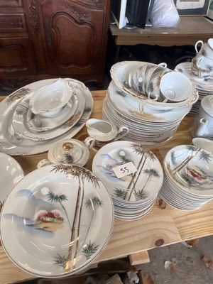 a lot of plates and bowls on a table