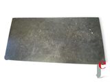a close up of a piece of metal on a white background