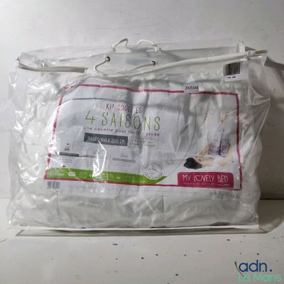 a bag with a pillow on top of it on a table
