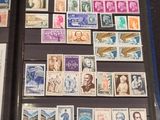 a lot of stamps that are on display on a table