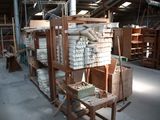 a large room with a lot of wood and a lot of boxes