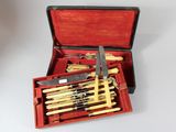 a red case with a set of knives in it
