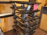 a stack of pots and pans on a cart in a kitchen