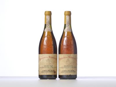 two bottles of wine sitting on top of a table