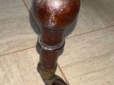 a close up of a wooden table with a shoe on it