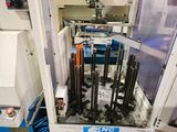 a picture of a machine that is working on a piece of machinery