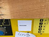 a close up of a yellow machine with a label on it