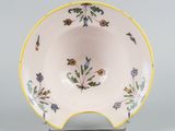 an image of a bowl with a flower design on it