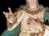 a statue of a woman holding a baby in her arms