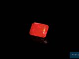 an image of a red light in the dark with a black background
