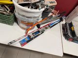 a bucket of paint and tools sitting on a table