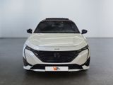 the front view of a white car in a white room