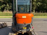 a tractor that is parked on the side of the road