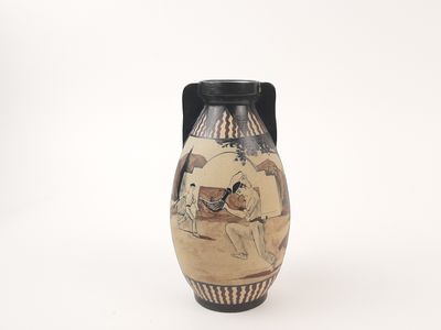 a vase with a picture of a man riding a horse