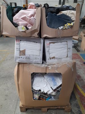 two boxes of clothes sitting on top of each other
