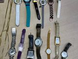 many different types of watches laid out on the table
