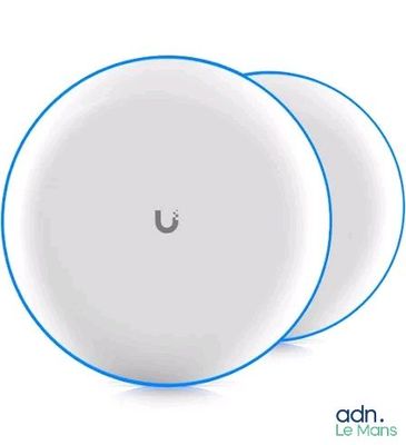 a close up of three white circular devices on a white surface