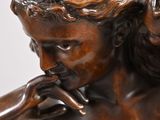 bronze statue of a woman holding a baby in her arms