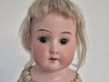 a small doll that is sitting on a table