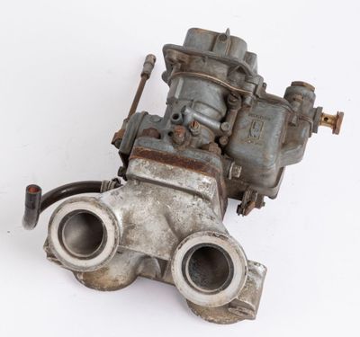 an old carbudge that is sitting on a white surface