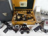 many different types of microscopes in a case