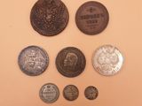 several coins are arranged in a circle on a beige surface