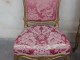 two chairs sitting next to each other in a room