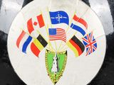 a picture of a sticker with flags and a coat of arms