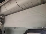 a bed in the back of an airplane with a mattress on it