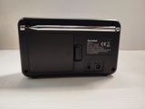 a black cell phone that is sitting on a table