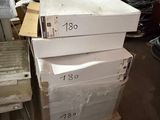 a stack of boxes sitting on top of a pallet in a warehouse